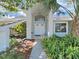 Inviting front entrance featuring a double door entry, well-kept landscaping and a covered walkway, creating a warm welcome at 1472 Overland Dr, Spring Hill, FL 34608