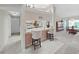 Kitchen area with counter seating overlooking sink and views to breakfast nook and dining at 1472 Overland Dr, Spring Hill, FL 34608