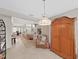 Open-concept living room with tile floors and an archway leading to the dining area at 1472 Overland Dr, Spring Hill, FL 34608