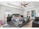 Bedroom features a ceiling fan, and stylish decor, creating a cozy and inviting space at 1614 E Nome St, Tampa, FL 33604