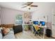 Bedroom with a ceiling fan and a desk setup near a window, offering a bright workspace at 1614 E Nome St, Tampa, FL 33604