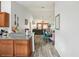 Open concept living room and dining area with hardwood floors, ceiling fan, and modern decor at 1614 E Nome St, Tampa, FL 33604