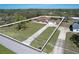 Aerial view of the property showing the layout of the house, driveway, and the extensive lot at 16247 Fringe Tree Dr, Spring Hill, FL 34610