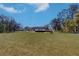 Beautiful home surrounded by a large green lawn and patio, perfect for outdoor activities at 16247 Fringe Tree Dr, Spring Hill, FL 34610