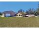 Expansive backyard featuring a deck, a gazebo, and ample green space for outdoor activities at 16247 Fringe Tree Dr, Spring Hill, FL 34610