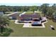 Aerial view of backyard featuring a cozy pool area with surrounding deck, patio, and plenty of space at 16247 Fringe Tree Dr, Spring Hill, FL 34610