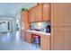 Well-organized kitchen area with cabinets, counter space, and a cozy corner perfect for a coffee station at 16247 Fringe Tree Dr, Spring Hill, FL 34610