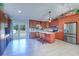 Spacious kitchen featuring an island with seating and stainless steel appliances, perfect for modern living at 16247 Fringe Tree Dr, Spring Hill, FL 34610