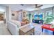 Inviting living room with large windows, plush seating, and a bright atmosphere at 16247 Fringe Tree Dr, Spring Hill, FL 34610