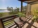 Relax on the balcony with a view of lush greenery and tranquil waters at 1720 Lighthouse S Ter # 8, South Pasadena, FL 33707