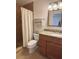 Tiled bathroom featuring shower and granite-topped vanity at 1720 Lighthouse S Ter # 8, South Pasadena, FL 33707