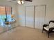 Bedroom with ceiling fan, closet, desk and chair set at 1720 Lighthouse S Ter # 8, South Pasadena, FL 33707