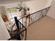 Spiral staircase overlooking a bedroom with waterfront balcony at 1720 Lighthouse S Ter # 8, South Pasadena, FL 33707