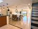 Open floor plan showcasing dining and living areas with water views at 1720 Lighthouse S Ter # 8, South Pasadena, FL 33707