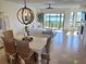 Inviting living space with coastal decor, dining area, and stunning water views at 1720 Lighthouse S Ter # 8, South Pasadena, FL 33707