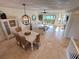 Inviting living space with coastal decor, dining area, and stunning water views at 1720 Lighthouse S Ter # 8, South Pasadena, FL 33707