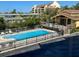 Beautiful outdoor pool with a spacious deck and a view of the surrounding buildings and harbor at 1720 Lighthouse S Ter # 8, South Pasadena, FL 33707