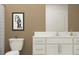 Modern bathroom featuring white cabinets, marble countertops, and sleek fixtures, creating a relaxing space at 1814 Tropical Oasis Ave, Plant City, FL 33565