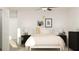 Bright bedroom with a cozy bed, decorative wall art, and elegant nightstands, creating a peaceful retreat at 1814 Tropical Oasis Ave, Plant City, FL 33565