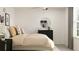 Comfortable bedroom featuring a plush bed, dresser, and window view, enhancing its relaxing atmosphere at 1814 Tropical Oasis Ave, Plant City, FL 33565