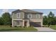 Charming two-story home with a well-manicured lawn and attached two-car garage in a tranquil neighborhood at 1814 Tropical Oasis Ave, Plant City, FL 33565