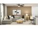 Stylish living room with a sectional sofa, a round coffee table, and a dedicated workspace with a modern desk at 1814 Tropical Oasis Ave, Plant City, FL 33565