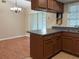Kitchen and dining area with plenty of counter space and natural light at 2140 Redleaf Dr, Brandon, FL 33510