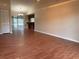 Spacious living room featuring laminate floors, sliding glass doors and a wet bar at 2140 Redleaf Dr, Brandon, FL 33510