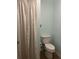Bathroom featuring a toilet, curtain and blue walls at 2583 Countryside Blvd # 3102, Clearwater, FL 33761