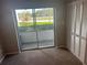 Bedroom with sliding glass door to patio and large closet with paneled doors at 2583 Countryside Blvd # 3102, Clearwater, FL 33761