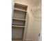 Open closet with built-in shelving and wire rack, providing ample storage solutions at 2583 Countryside Blvd # 3102, Clearwater, FL 33761