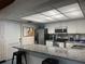 Community kitchen featuring granite countertops, stainless steel appliances, and ample cabinet space at 2583 Countryside Blvd # 3102, Clearwater, FL 33761