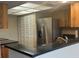 Modern kitchen with stainless steel appliances, granite countertops, and ample cabinet space at 2583 Countryside Blvd # 3102, Clearwater, FL 33761