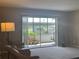 Bright living room with comfortable seating and sliding glass doors offering views of the outdoors at 2583 Countryside Blvd # 3102, Clearwater, FL 33761