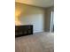 Spacious carpeted living room features modern decor and sliding glass doors at 2583 Countryside Blvd # 3102, Clearwater, FL 33761