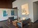 Lobby featuring modern seating arrangement with decorative wall art, a decorative shelf, and a brown carpet at 2583 Countryside Blvd # 3102, Clearwater, FL 33761