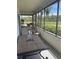 Relax on this screened patio with views of lush tropical landscaping and outdoor dining area at 2583 Countryside Blvd # 3102, Clearwater, FL 33761