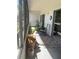 Outdoor patio area furnished with chairs and table, plus potted plants and rug at 2583 Countryside Blvd # 3102, Clearwater, FL 33761