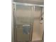 Enclosed shower with sliding glass door and a convenient towel bar at 2583 Countryside Blvd # 3102, Clearwater, FL 33761