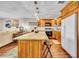 Bright kitchen featuring granite countertops, modern appliances, and wood cabinets at 2612 Pearce Dr # 209, Clearwater, FL 33764