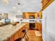Bright kitchen featuring granite countertops, modern appliances, and wood cabinets at 2612 Pearce Dr # 209, Clearwater, FL 33764