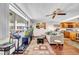 Bright living room with hardwood floors, a comfortable sofa, and a view of the outside at 2612 Pearce Dr # 209, Clearwater, FL 33764