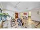 Lobby with tiled floors, seating, and potted plants near a window with natural lighting at 2612 Pearce Dr # 209, Clearwater, FL 33764