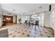 Lobby features tiled floors, seating, and an elevator with natural lighting at 2612 Pearce Dr # 209, Clearwater, FL 33764