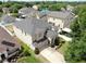 Aerial view of a two-story home with a well-manicured lawn and landscaping in a residential neighborhood at 312 Taxter Run Ln, Valrico, FL 33594