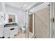 Modern bathroom featuring a glass-enclosed shower with modern finishes and vanity with sink at 312 Taxter Run Ln, Valrico, FL 33594