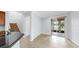 Bright dining area with sliding glass doors leading to an outdoor patio and staircase to the left at 312 Taxter Run Ln, Valrico, FL 33594