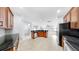 Open kitchen with wood cabinets, stainless steel appliances, and a breakfast bar at 312 Taxter Run Ln, Valrico, FL 33594
