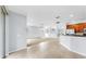 Bright, open-concept living room with tile flooring and seamless access to the kitchen at 312 Taxter Run Ln, Valrico, FL 33594