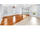 Bright living room with hardwood floors, recessed lighting, and a decorative glass front door at 312 Taxter Run Ln, Valrico, FL 33594